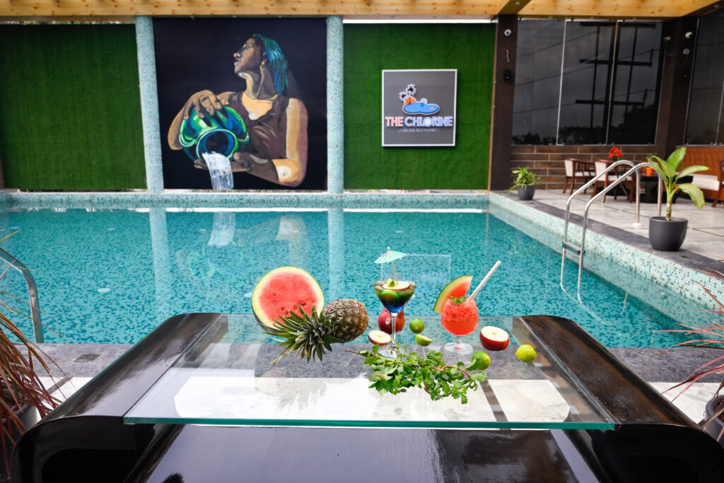 view of swimming pool along with mocktails